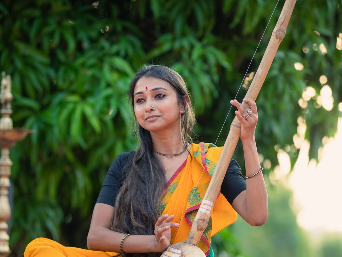 Musician playing a traditional Indian string instrument