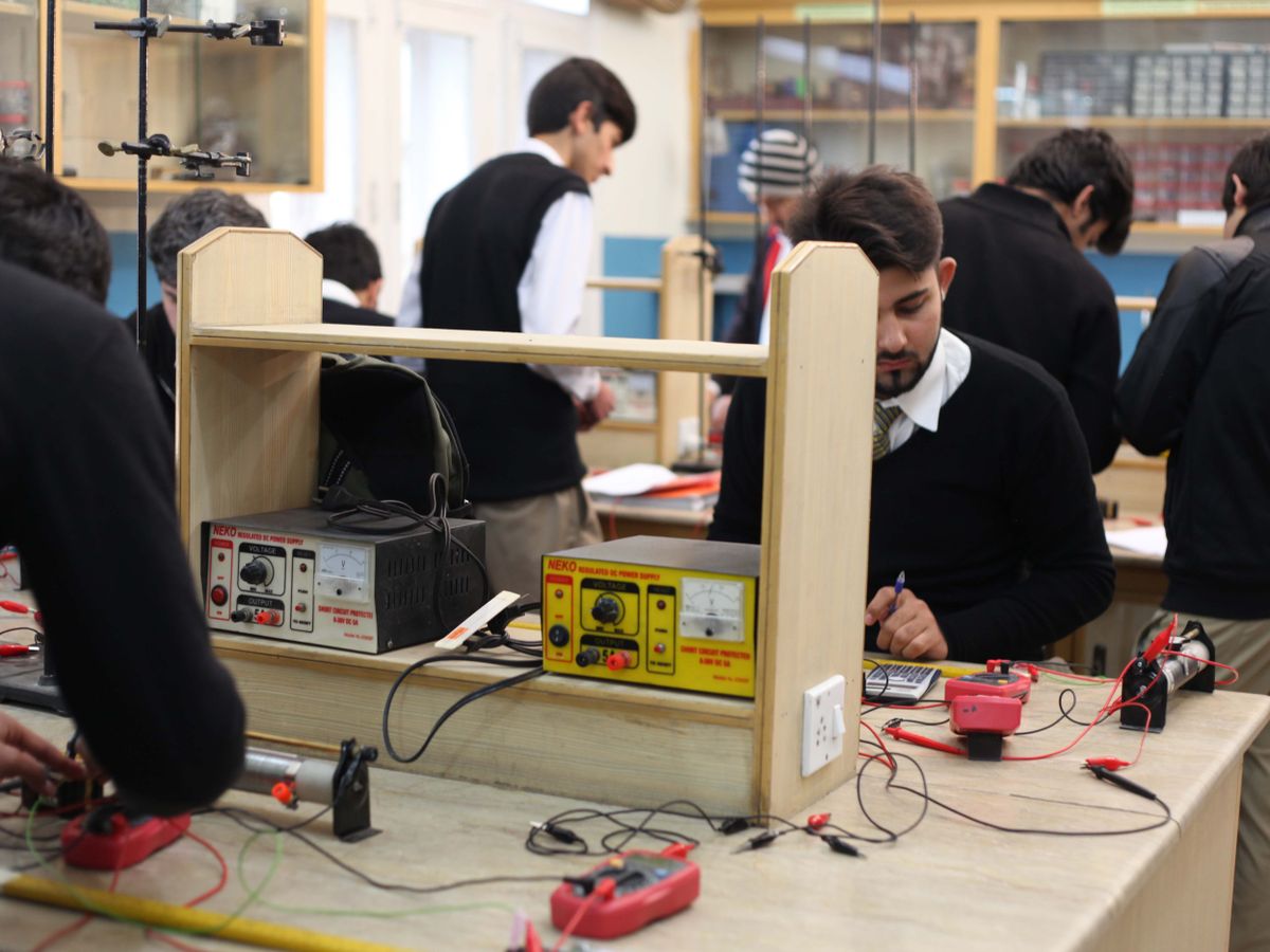 Students working in a STEM electronics and robotics lab